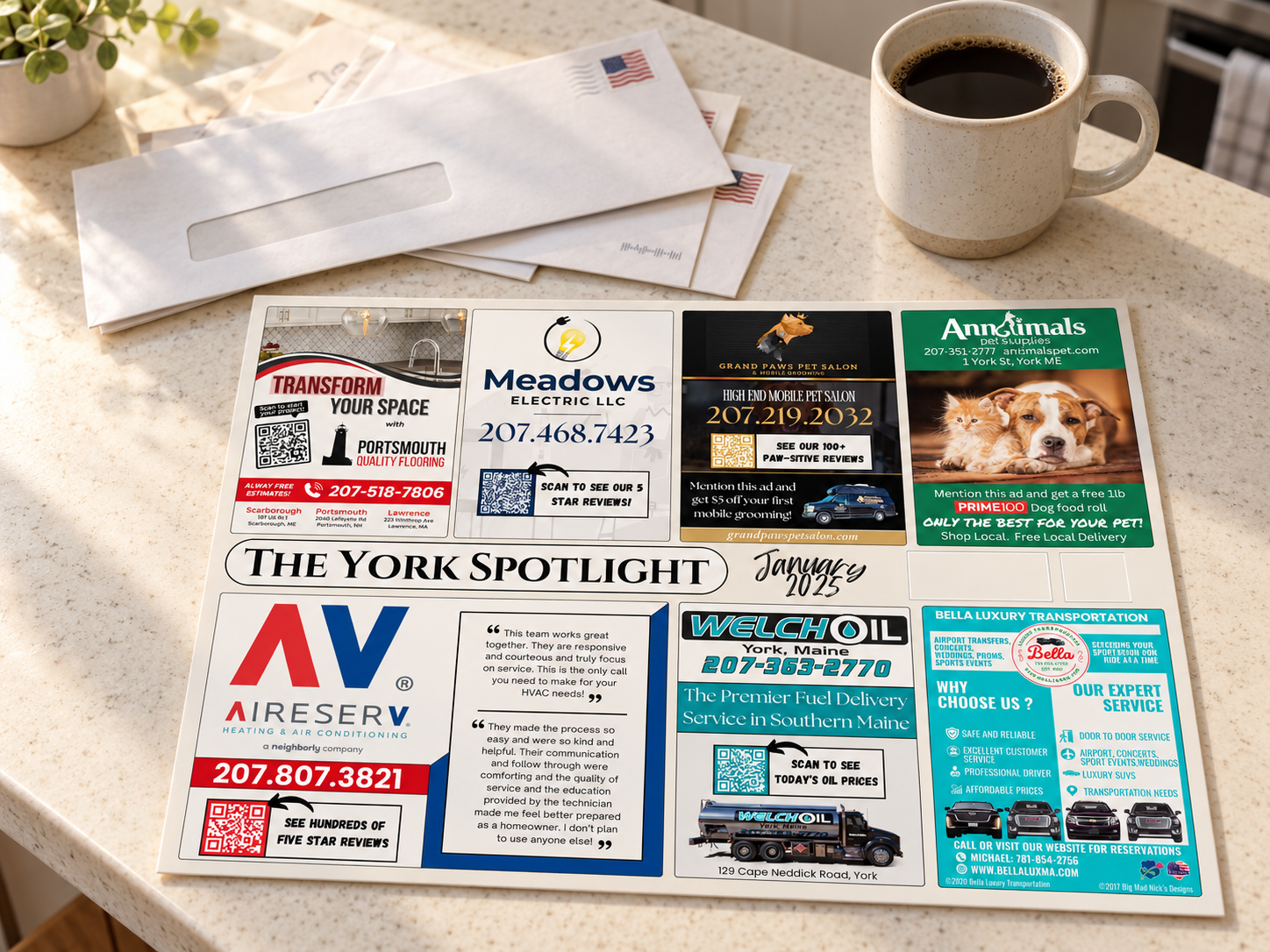A 9 × 12 jumbo card mailer displayed on a countertop beside envelopes and a cup of coffee